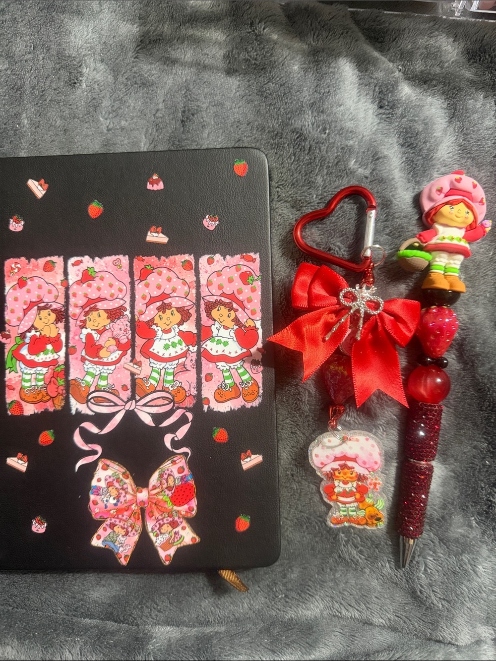 Black & red Strawberry shortcake journal with matching pen and keychain.